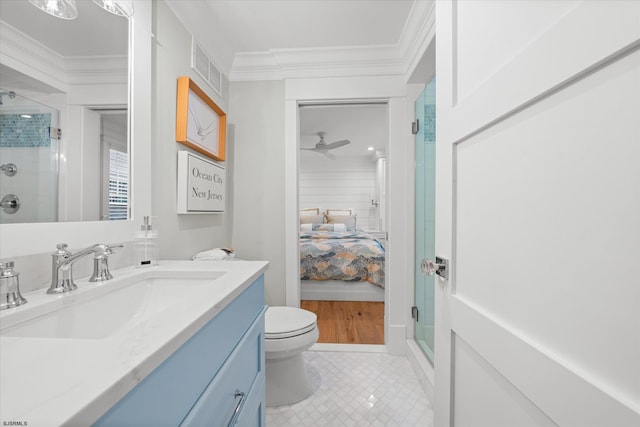 bathroom featuring vanity, crown molding, ceiling fan, toilet, and an enclosed shower