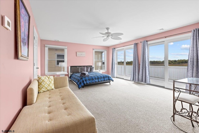 bedroom with carpet, ceiling fan, and access to outside