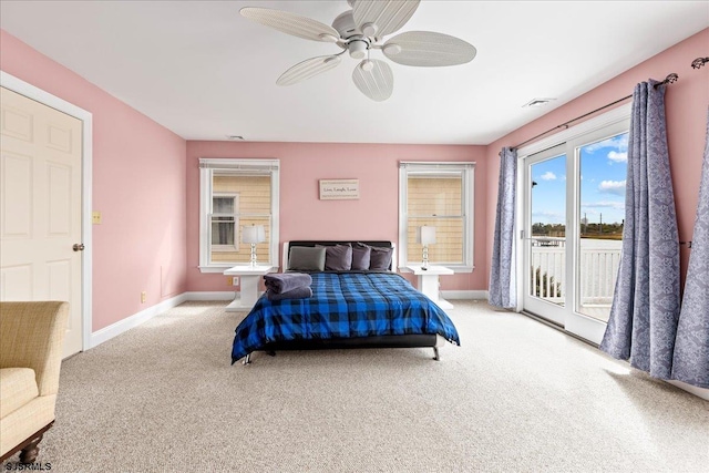 bedroom with access to outside, light colored carpet, and ceiling fan