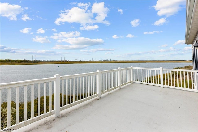 exterior space with a balcony and a water view