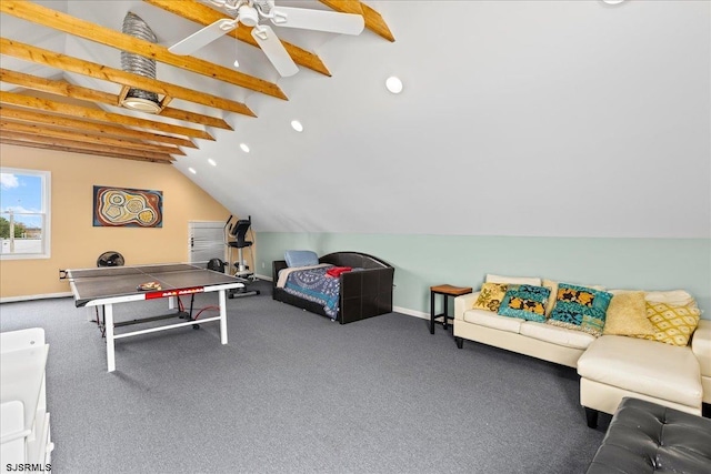 recreation room with ceiling fan, vaulted ceiling with beams, and carpet