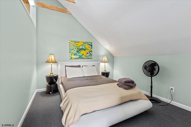 bedroom with carpet floors and vaulted ceiling