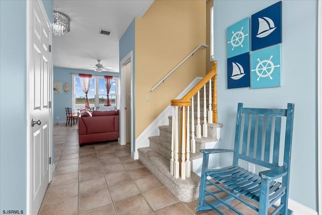 stairs with ceiling fan