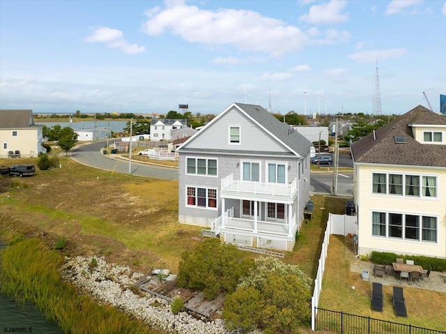 rear view of house featuring a balcony