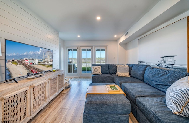 living room featuring light hardwood / wood-style flooring and french doors