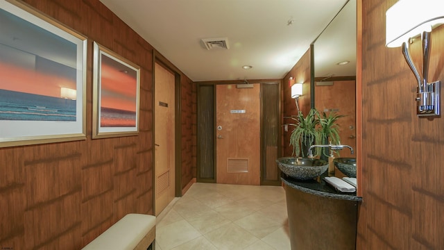 interior space with wooden walls and sink