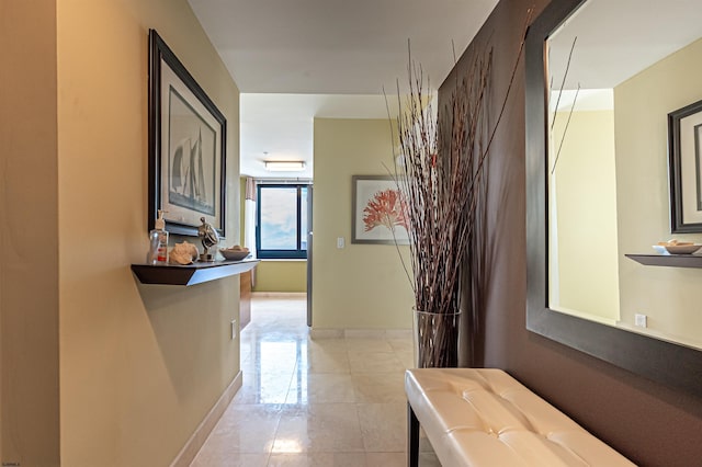 hall featuring light tile patterned floors