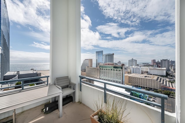 balcony featuring a water view