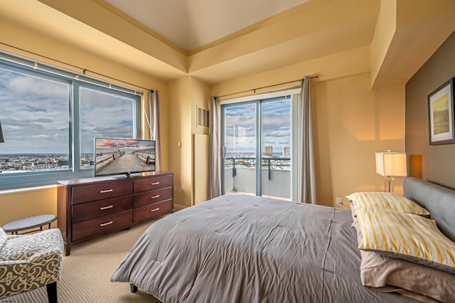 carpeted bedroom featuring access to exterior