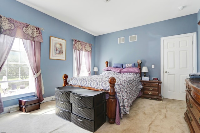 bedroom featuring light carpet