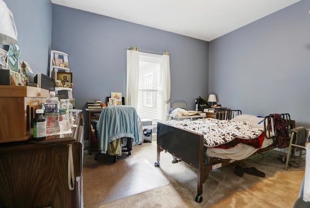 bedroom with light colored carpet