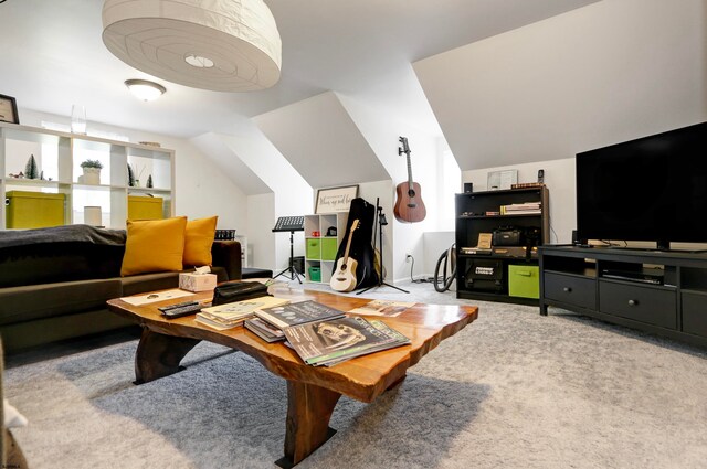 carpeted living room with lofted ceiling