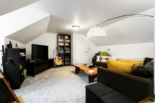 carpeted living room featuring vaulted ceiling