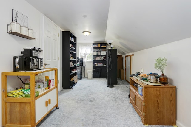 interior space with light colored carpet and lofted ceiling