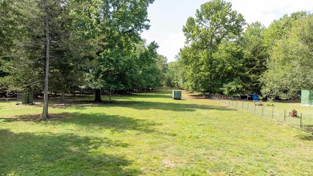 view of yard with a rural view