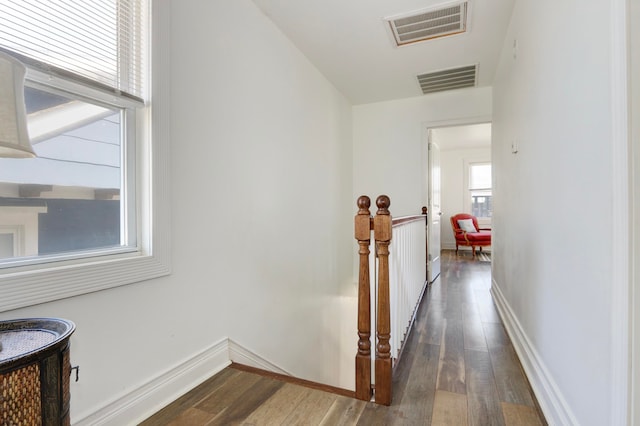 hallway with dark wood-type flooring