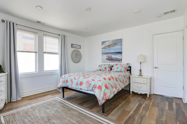 bedroom featuring dark wood-type flooring