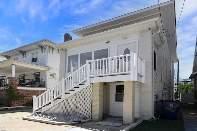 view of front of property featuring a sunroom