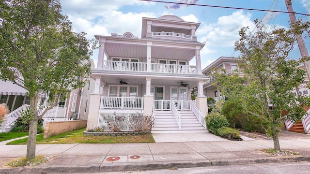 view of front of home with ceiling fan and a porch