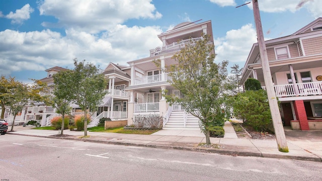 view of front of house featuring a balcony and covered porch