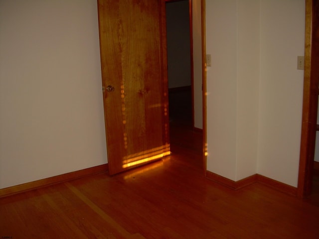 empty room featuring hardwood / wood-style flooring