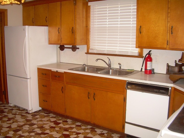 kitchen with white appliances and sink