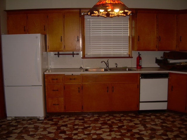 kitchen featuring sink and white appliances