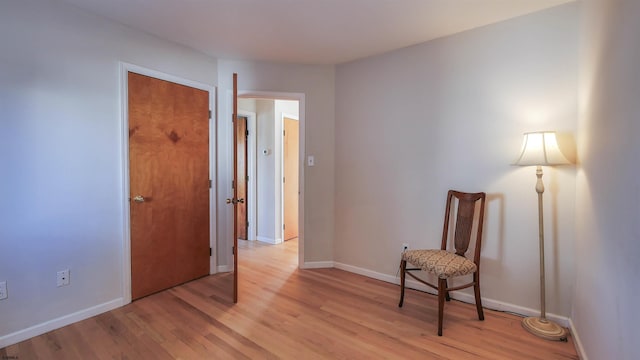 living area with light hardwood / wood-style floors