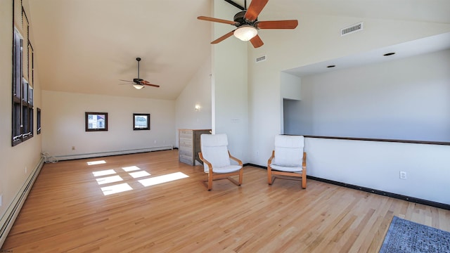 unfurnished room featuring ceiling fan, a baseboard radiator, light wood-type flooring, and high vaulted ceiling