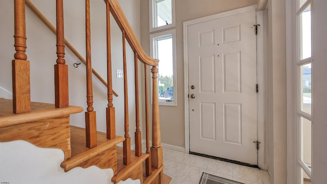 foyer with light tile patterned floors