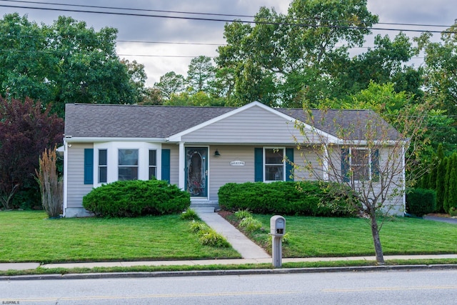 ranch-style home with a front lawn