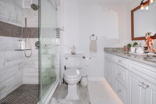 bathroom with walk in shower, vanity, and toilet