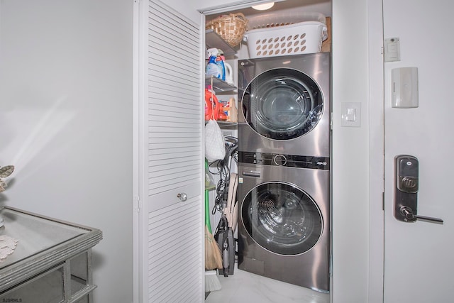 laundry room featuring stacked washer and dryer