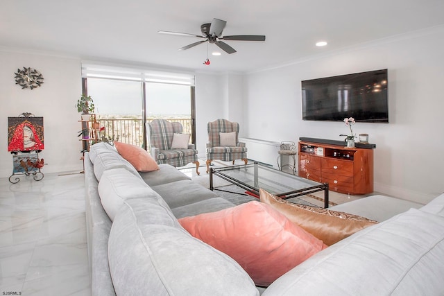 living room with ceiling fan and ornamental molding