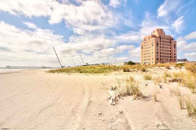 exterior space with a beach view and a water view