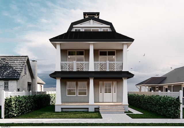 view of front of house featuring a balcony, covered porch, and a front lawn