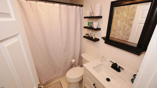 bathroom featuring tile patterned flooring, walk in shower, vanity, and toilet