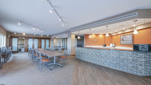 dining space with hardwood / wood-style flooring