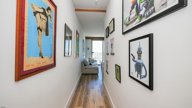 hall featuring beam ceiling and dark hardwood / wood-style flooring