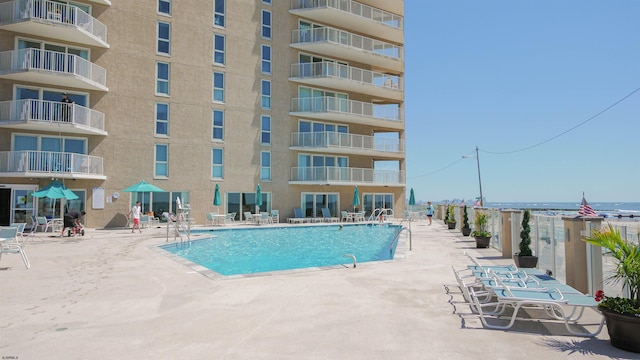 view of swimming pool with a patio area