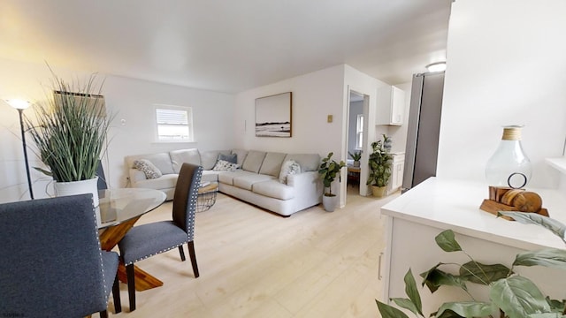 living room with light hardwood / wood-style flooring