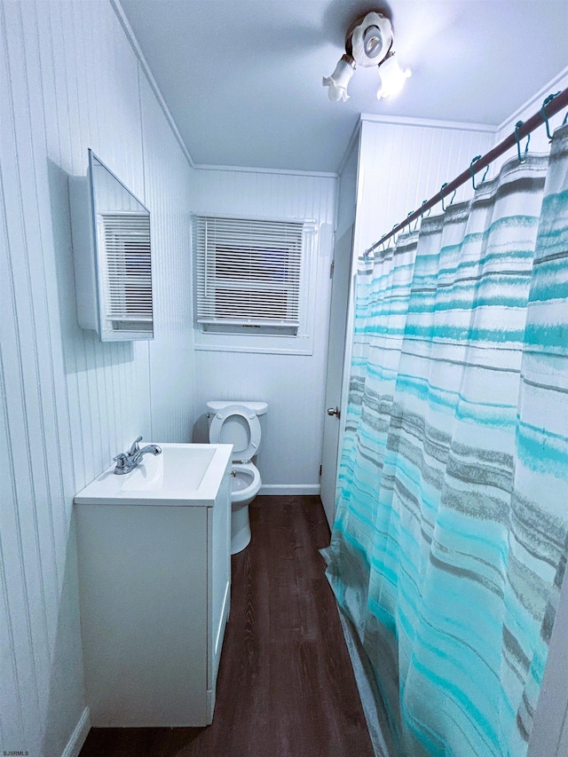 bathroom with vanity, toilet, ornamental molding, hardwood / wood-style floors, and a shower with shower curtain