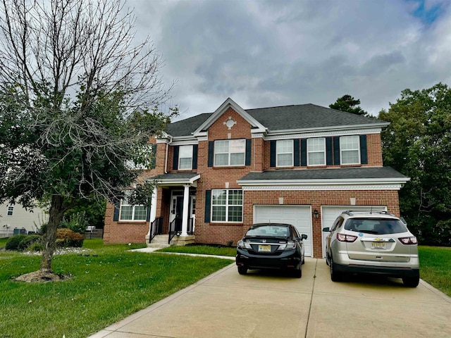 view of front facade with a front yard and a garage