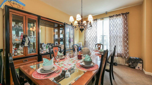 dining space with carpet flooring and a notable chandelier