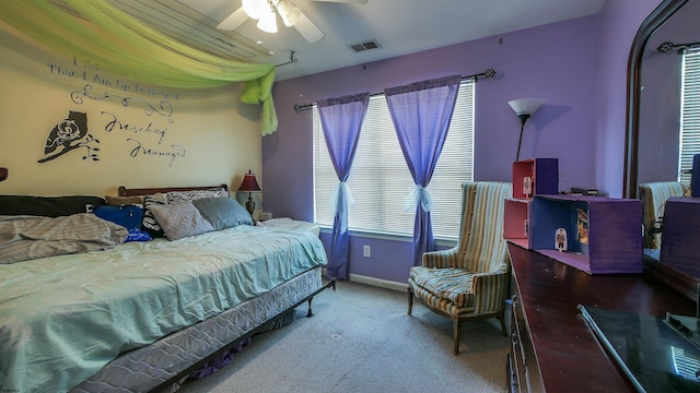 bedroom with multiple windows, carpet flooring, and ceiling fan