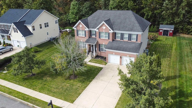 view of front of property featuring a garage and a front yard