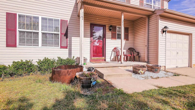 property entrance featuring covered porch and a garage