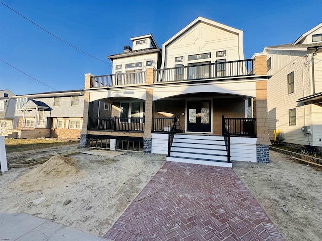 27 Spruce Rd, Ocean City, NJ 08226 - townhome / multi-family property with a balcony and covered porch