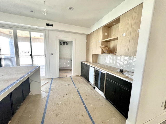 27 Spruce Rd, Ocean City, NJ 08226 - kitchen with dark cabinetry, backsplash, wine cooler, modern cabinets, and open shelves