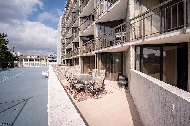 view of patio / terrace with a balcony and a grill